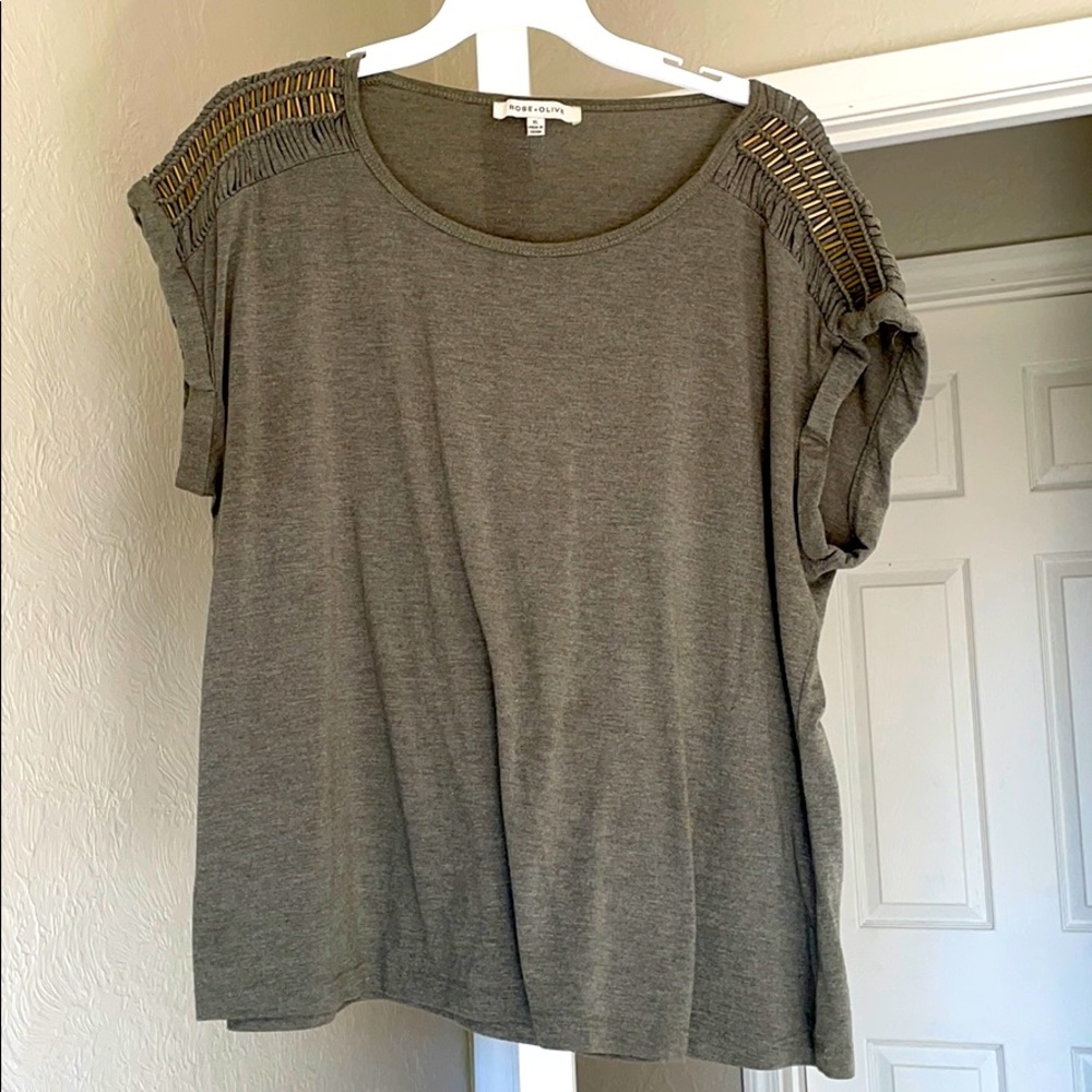 Olive cap sleeved shirt with shoulder detail.